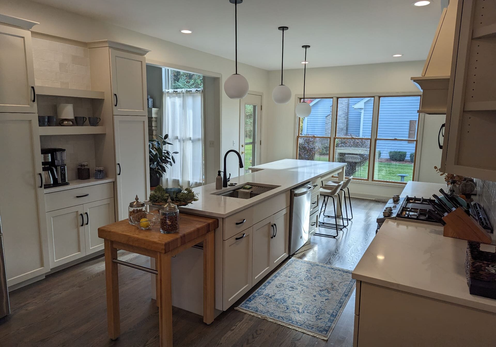 Bright kitchen with large windows and island